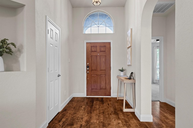 60 N Highland Dr, Sanger, TX 76266 - entrance foyer featuring dark wood-style floors and arched walkways