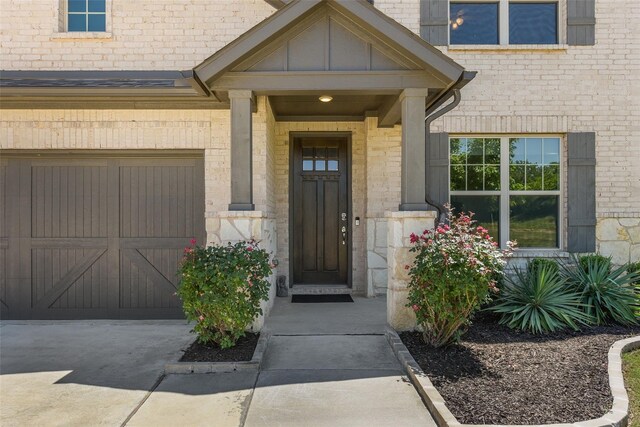 216 Shadow Creek Ln, Hickory Creek, TX 75065 - property entrance featuring concrete driveway and brick siding