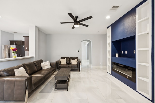 433 Willow Bend Dr, Murphy, TX 75094 - living room featuring arched walkways, ceiling fan, light marble finish flooring, recessed lighting, and built in features