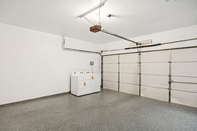 433 Willow Bend Dr, Murphy, TX 75094 - garage featuring a garage door opener and washer and clothes dryer