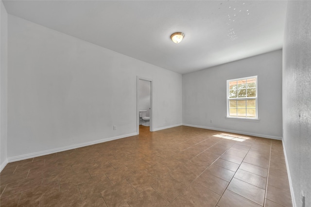 2522 Refugio Ave, Fort Worth, TX 76164 - unfurnished room with baseboards and tile patterned flooring