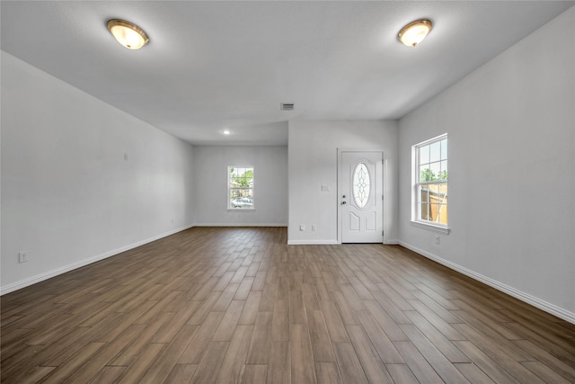 2522 Refugio Ave, Fort Worth, TX 76164 - foyer with healthy amount of natural light and dark wood-style floors