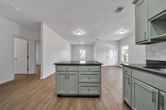 2522 Refugio Ave, Fort Worth, TX 76164 - kitchen with light wood-type flooring and a center island
