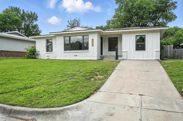 5416 Purington Ave, Fort Worth, TX 76112 - single story home with board and batten siding, driveway, and brick siding