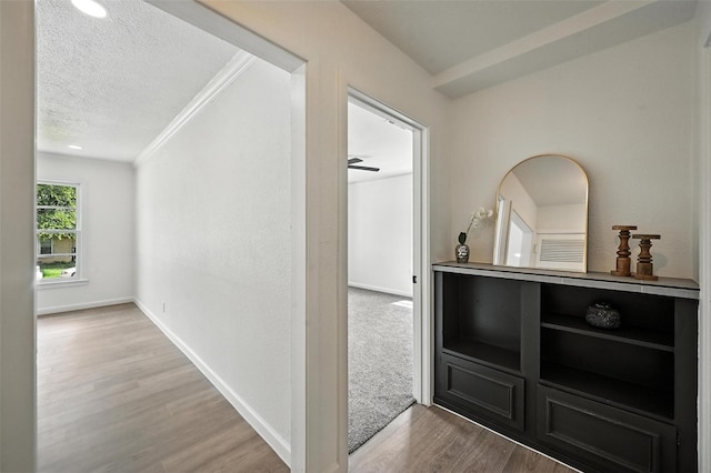 5416 Purington Ave, Fort Worth, TX 76112 - hall with wood finished floors, a textured ceiling, and crown molding