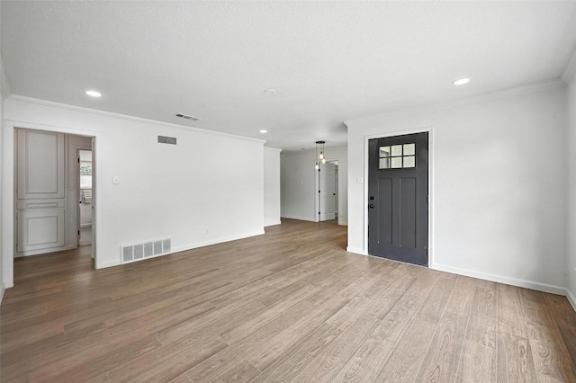 5416 Purington Ave, Fort Worth, TX 76112 - foyer entrance with crown molding, wood finished floors, and recessed lighting