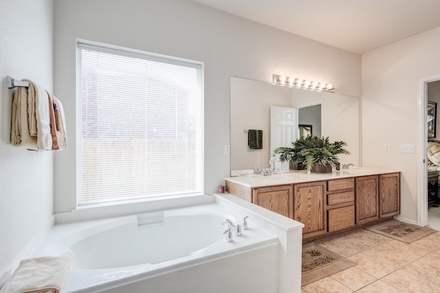 13317 Spinning Glen St, Fort Worth, TX 76040 - bathroom with a garden tub, double vanity, and tile patterned flooring
