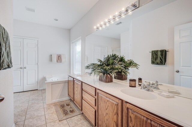13317 Spinning Glen St, Fort Worth, TX 76040 - bathroom featuring double vanity, a garden tub, tile patterned flooring, and a shower