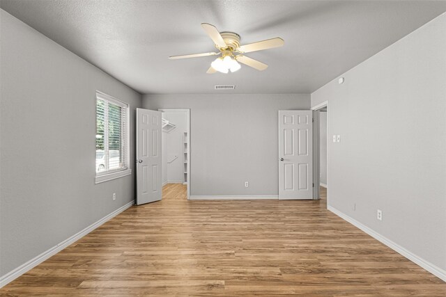 5207 Atlantis Ter, Arlington, TX 76016 - empty room featuring a ceiling fan and light wood-style flooring