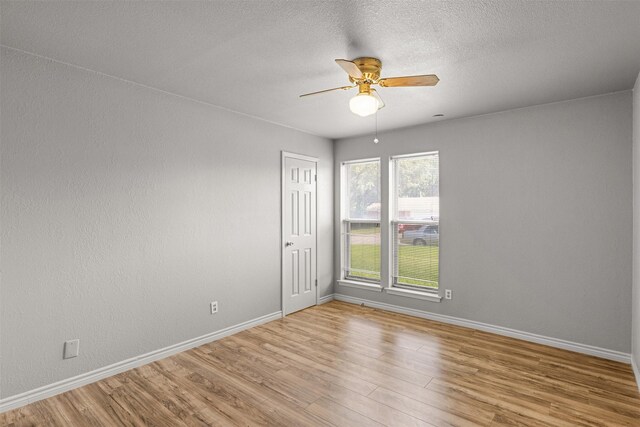 5207 Atlantis Ter, Arlington, TX 76016 - unfurnished room featuring wood finished floors, ceiling fan, and a textured ceiling