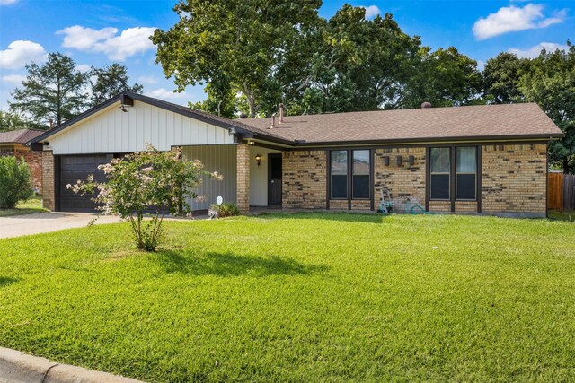 5207 Atlantis Ter, Arlington, TX 76016 - ranch-style house with brick siding, a garage, driveway, a front yard, and roof with shingles