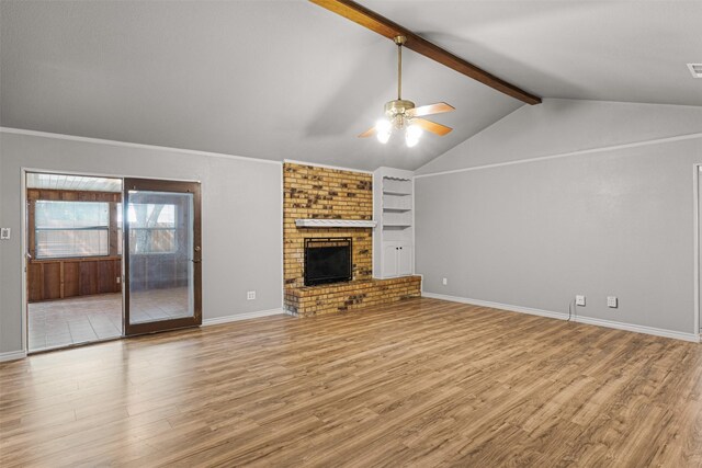5207 Atlantis Ter, Arlington, TX 76016 - unfurnished living room with ceiling fan, wood finished floors, and a brick fireplace