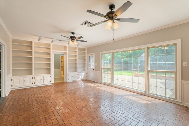 601 N 25th St, Corsicana, TX 75110 - unfurnished room with ceiling fan, crown molding, built in shelves, and brick patterned flooring