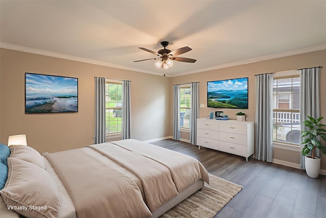 601 N 25th St, Corsicana, TX 75110 - bedroom featuring crown molding, dark wood-type flooring, and a ceiling fan