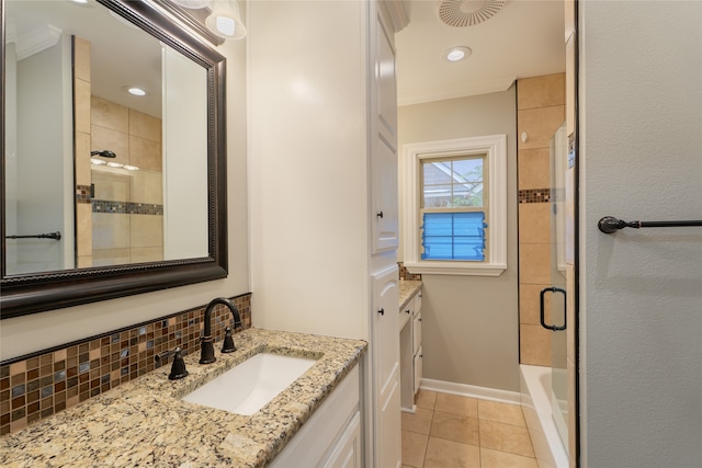 601 N 25th St, Corsicana, TX 75110 - full bathroom with vanity, backsplash, tile patterned flooring, ornamental molding, and washtub / shower combination