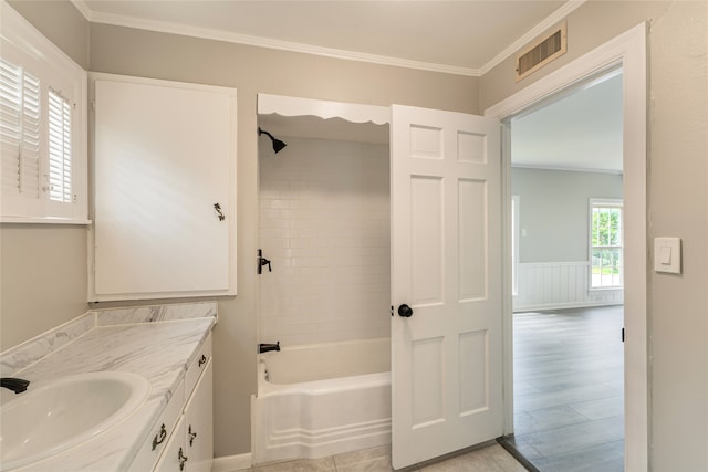 601 N 25th St, Corsicana, TX 75110 - bathroom featuring vanity, bathing tub / shower combination, and ornamental molding
