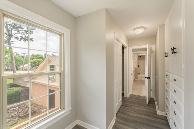 601 N 25th St, Corsicana, TX 75110 - hall with dark wood-style floors and baseboards
