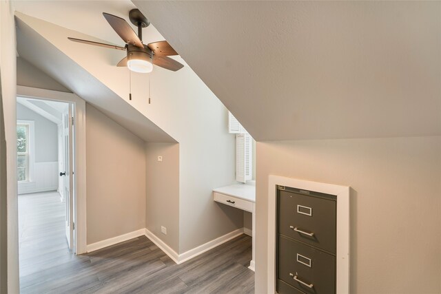 601 N 25th St, Corsicana, TX 75110 - additional living space with wood finished floors, vaulted ceiling, and a ceiling fan