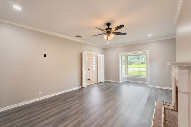 601 N 25th St, Corsicana, TX 75110 - unfurnished living room with ceiling fan, dark wood-style floors, recessed lighting, and crown molding