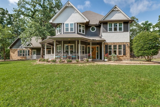 3700 Red Oak Dr, Corinth, TX 76208 - view of front of house with a porch, brick siding, and a front yard