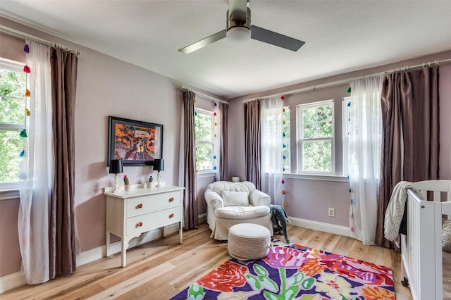 3700 Red Oak Dr, Corinth, TX 76208 - bedroom with multiple windows, light wood-style flooring, and ceiling fan