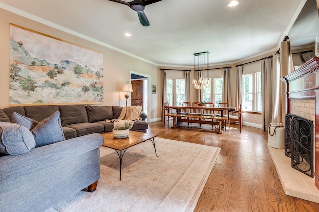 3700 Red Oak Dr, Corinth, TX 76208 - living room featuring wood finished floors, ornamental molding, ceiling fan, recessed lighting, and a fireplace