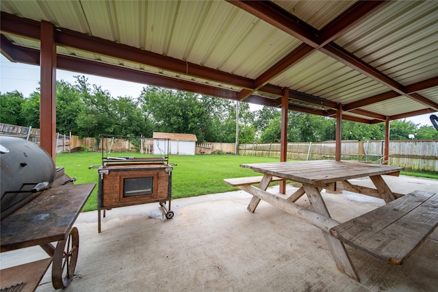 1032 Hampton Dr, Forney, TX 75126 - fenced backyard featuring a patio, outdoor dining area, and a storage unit