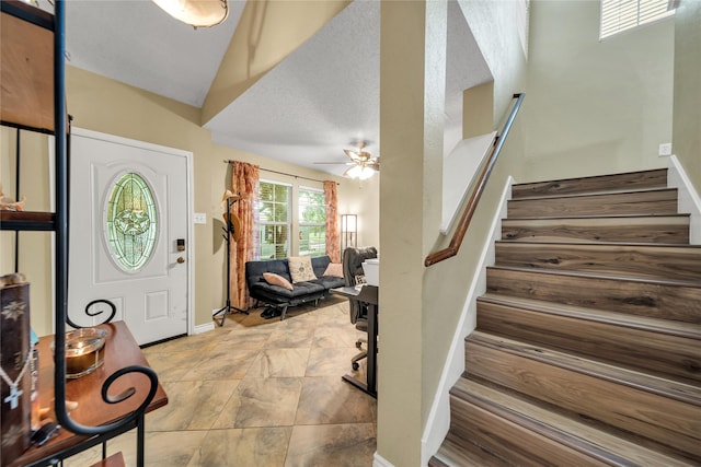 1032 Hampton Dr, Forney, TX 75126 - entrance foyer with stairway, a ceiling fan, and stone finish floors