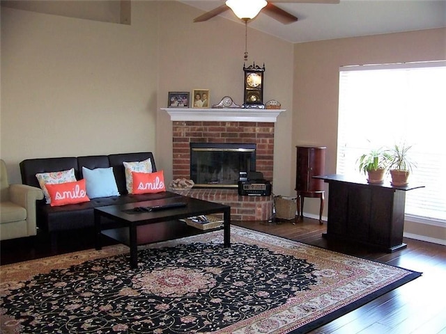 7215 Fossil Hill Dr, Arlington, TX 76002 - living room featuring wood finished floors, a ceiling fan, a brick fireplace, and lofted ceiling