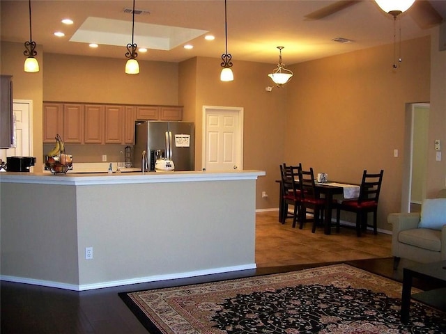 7215 Fossil Hill Dr, Arlington, TX 76002 - kitchen featuring stainless steel refrigerator with ice dispenser, pendant lighting, light countertops, recessed lighting, and wood finished floors