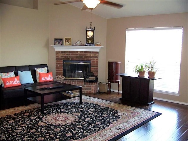 7215 Fossil Hill Dr, Arlington, TX 76002 - living area featuring plenty of natural light, wood finished floors, a ceiling fan, a brick fireplace, and lofted ceiling