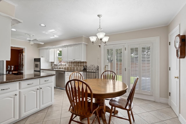 10707 Ferndale Rd, Dallas, TX 75238 - dining space with light tile patterned floors, a chandelier, a ceiling fan, recessed lighting, and ornamental molding