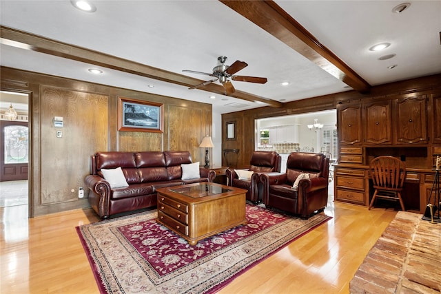 10707 Ferndale Rd, Dallas, TX 75238 - living room with light wood-type flooring, wooden walls, beamed ceiling, ceiling fan, and a chandelier