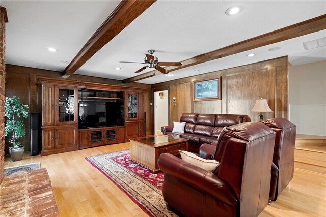 10707 Ferndale Rd, Dallas, TX 75238 - living room featuring beam ceiling, light wood-style flooring, a ceiling fan, wood walls, and recessed lighting