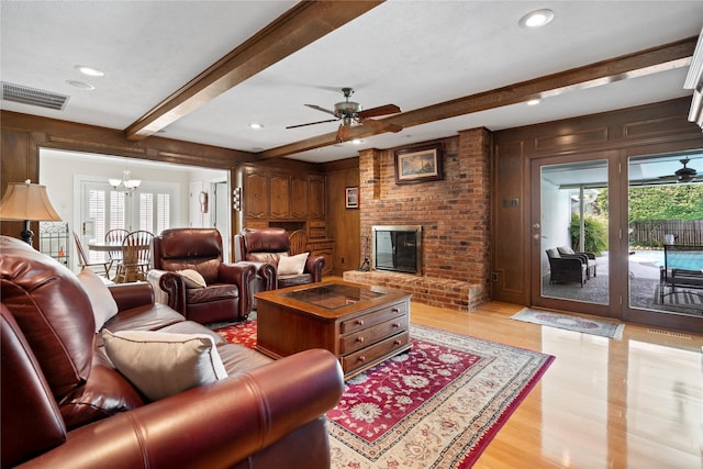 10707 Ferndale Rd, Dallas, TX 75238 - living area featuring beam ceiling, a chandelier, light wood finished floors, a fireplace, and ceiling fan