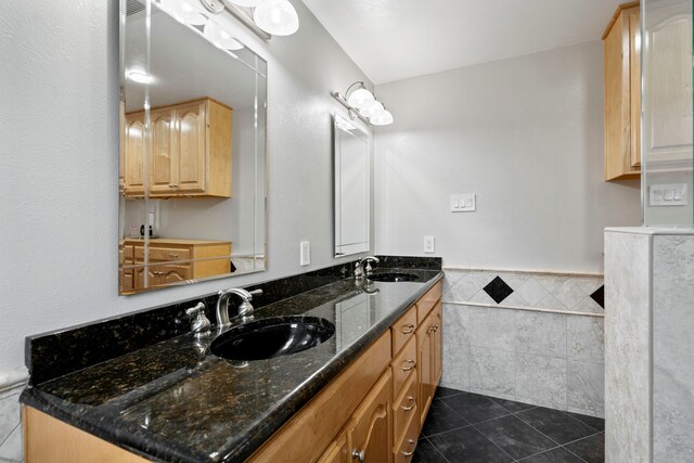 10707 Ferndale Rd, Dallas, TX 75238 - full bath featuring tile walls, tile patterned floors, wainscoting, and double vanity