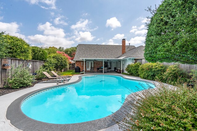 10707 Ferndale Rd, Dallas, TX 75238 - view of pool with a patio area, a fenced backyard, ceiling fan, and french doors
