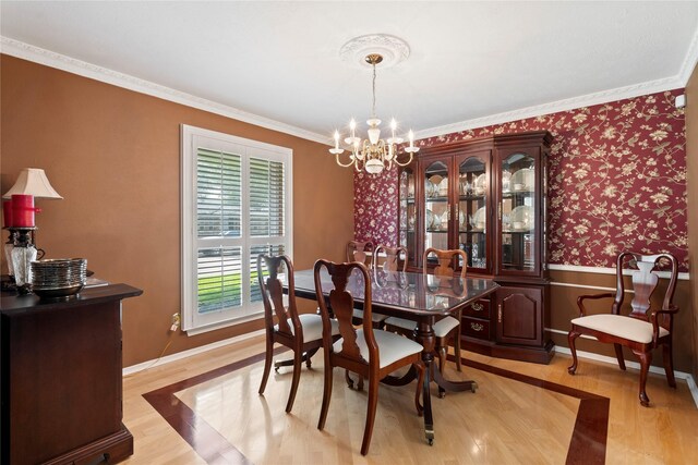 10707 Ferndale Rd, Dallas, TX 75238 - dining area featuring light wood-type flooring, ornamental molding, a chandelier, and a wainscoted wall