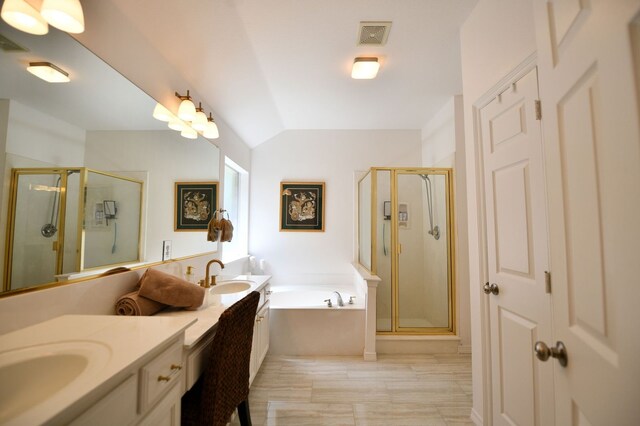 2505 Spring Hill Ln E, Garland, TX 75044 - bathroom featuring double vanity, lofted ceiling, a shower stall, and a garden tub