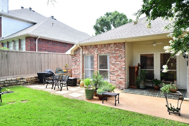 2505 Spring Hill Ln E, Garland, TX 75044 - fenced backyard featuring a patio, a ceiling fan, and area for grilling