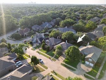 2505 Spring Hill Ln E, Garland, TX 75044 - aerial view of property's location with nearby suburban area and a heavily wooded area
