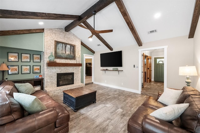 1322 Chestnut Rd, Mansfield, TX 76063 - living area with wood finished floors, a ceiling fan, and a fireplace