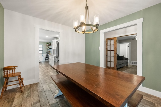 1322 Chestnut Rd, Mansfield, TX 76063 - dining space featuring a chandelier and wood finished floors