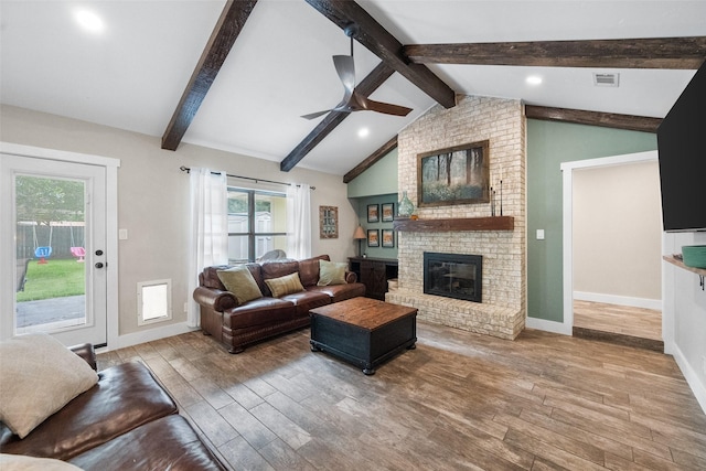 1322 Chestnut Rd, Mansfield, TX 76063 - living room featuring wood finished floors, a ceiling fan, and a fireplace