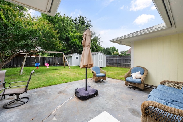 1322 Chestnut Rd, Mansfield, TX 76063 - fenced backyard with a storage unit, a patio area, and a playground
