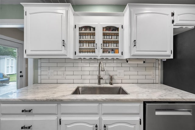 1322 Chestnut Rd, Mansfield, TX 76063 - kitchen with dishwasher, backsplash, and white cabinetry