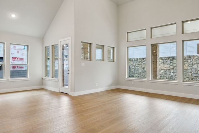 4505 N Summit View Dr, Mckinney, TX 75071 - spare room featuring light wood finished floors, high vaulted ceiling, and recessed lighting