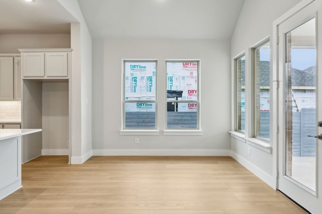 4505 N Summit View Dr, Mckinney, TX 75071 - unfurnished dining area with light wood finished floors and baseboards