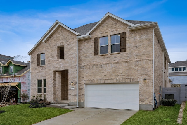4505 N Summit View Dr, Mckinney, TX 75071 - view of front of home with a garage, concrete driveway, a front lawn, brick siding, and roof with shingles