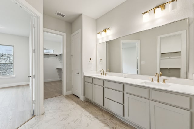 4505 N Summit View Dr, Mckinney, TX 75071 - bathroom with double vanity and a walk in closet